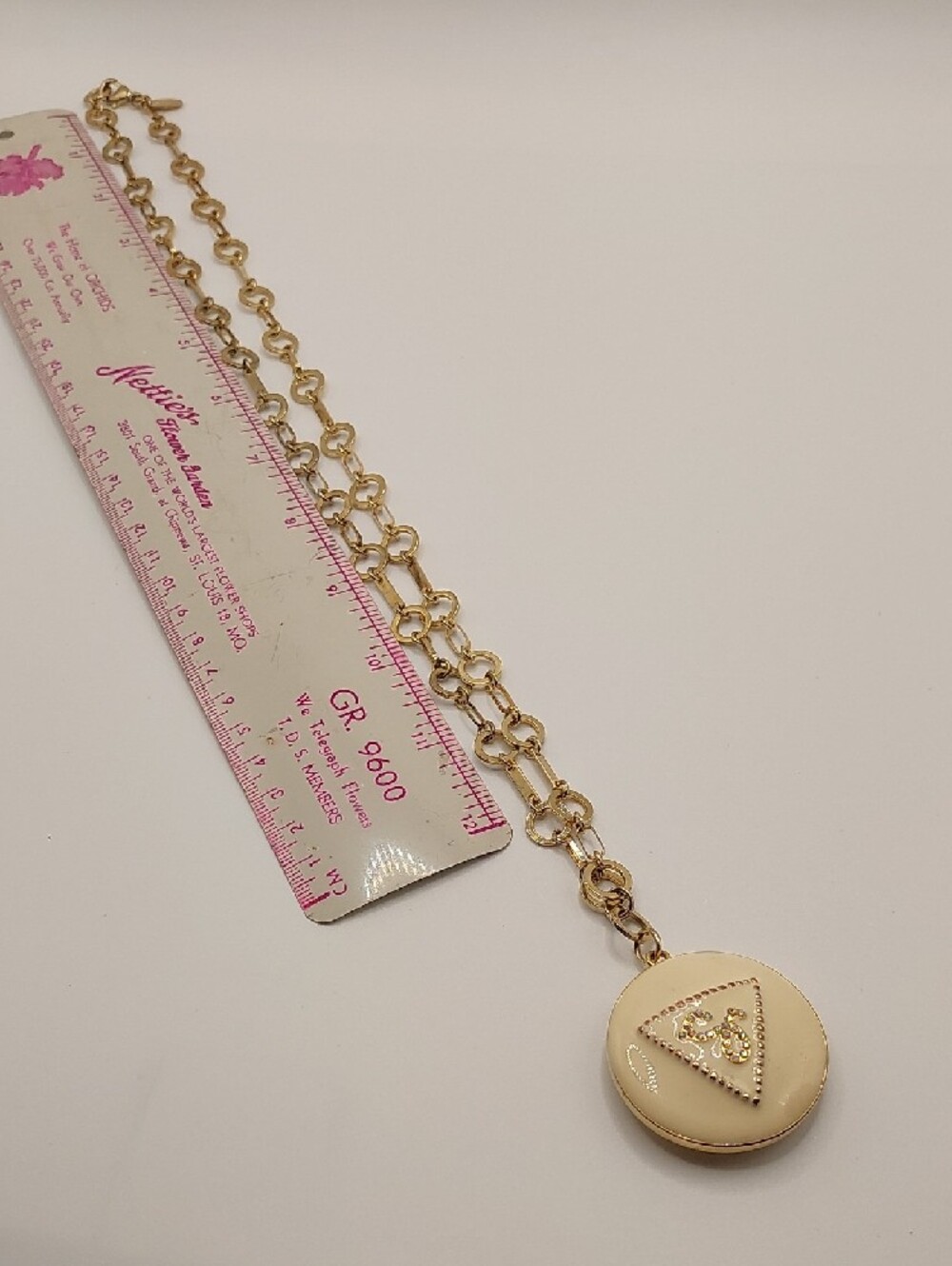 GUESS Blingy AB Gold-Tone Long Pendant Necklace with Cream Enamel Locket - Picture 6 of 14